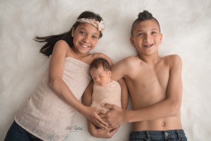 baby girl with older brother and sister