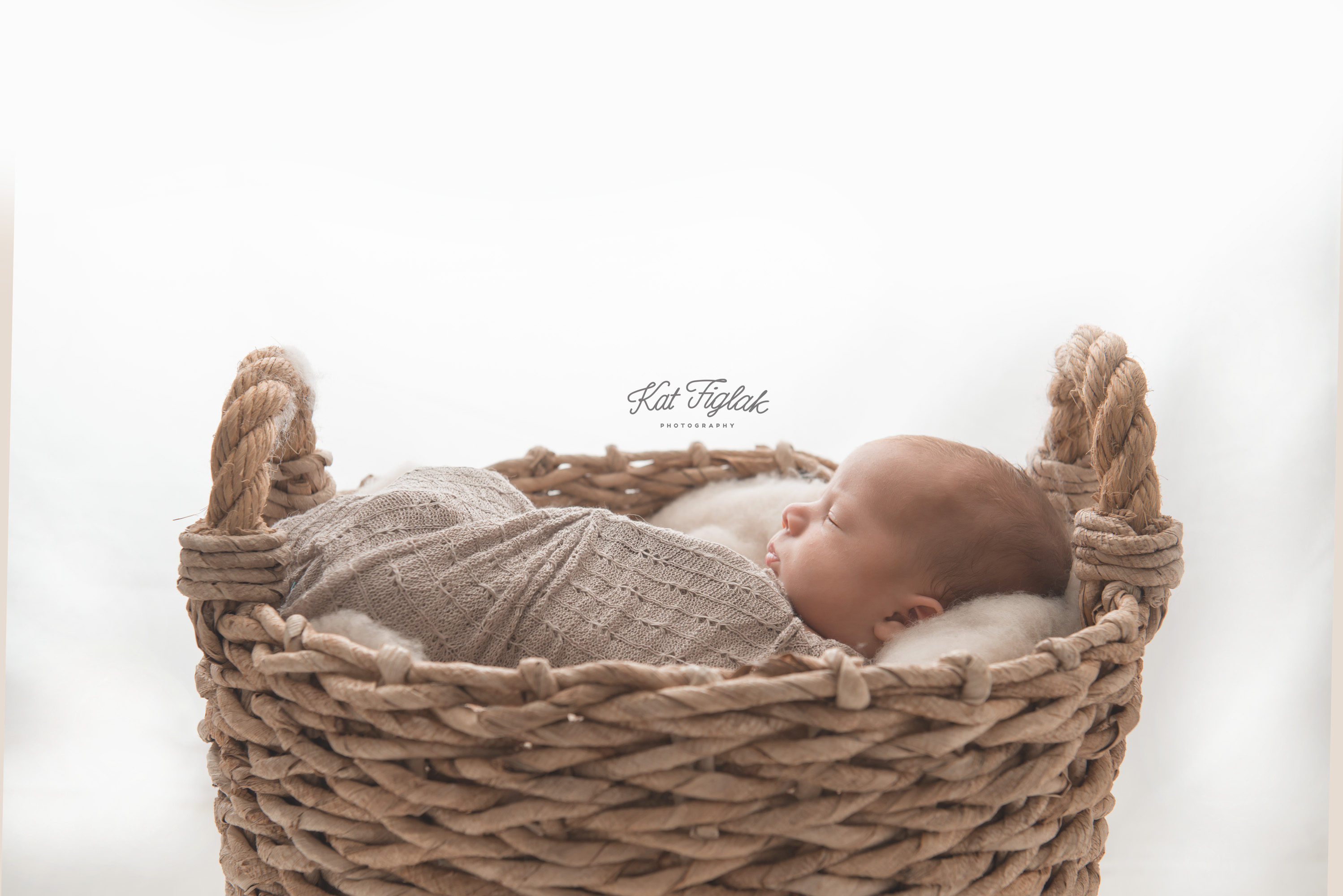 newborn baby boy silhouette photo laying in a basket