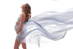 Pregnant mom in blue flowing dress