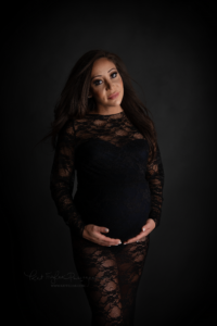 pregnant mom wearing a lace gown