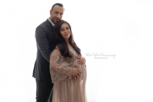 couple when the woman is pregnant wearing a boho gown