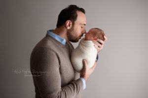 Dad holding his newborn baby boy